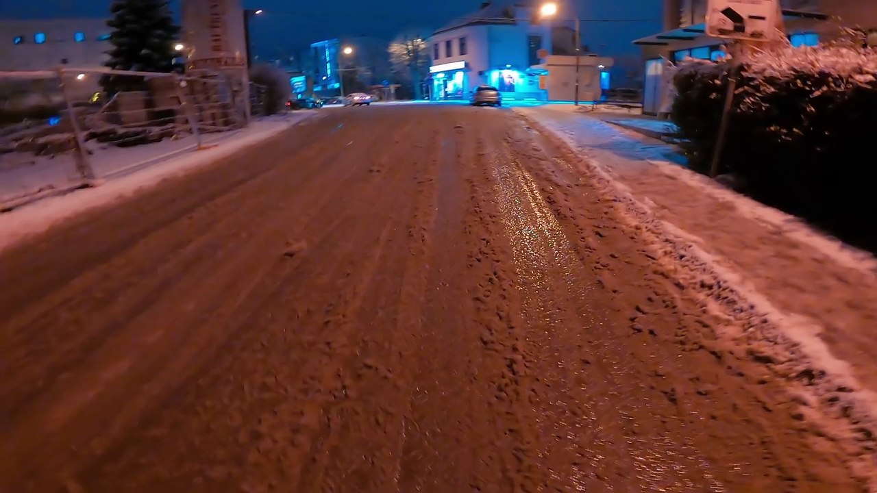 Snowy streets during cold winter day.