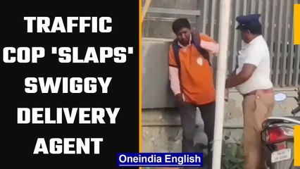 Descargar video: Traffic cop purportedly slaps Swiggy delivery agent, transferred on complaint | OneIndia News #News