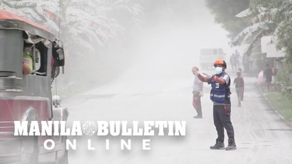 Residents clean up ash-covered houses after Philippines volcano erupts