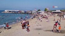 Bursa'da deniz sezonu açıldı: Sıcak havadan bunalanlar, sahillere akın etti