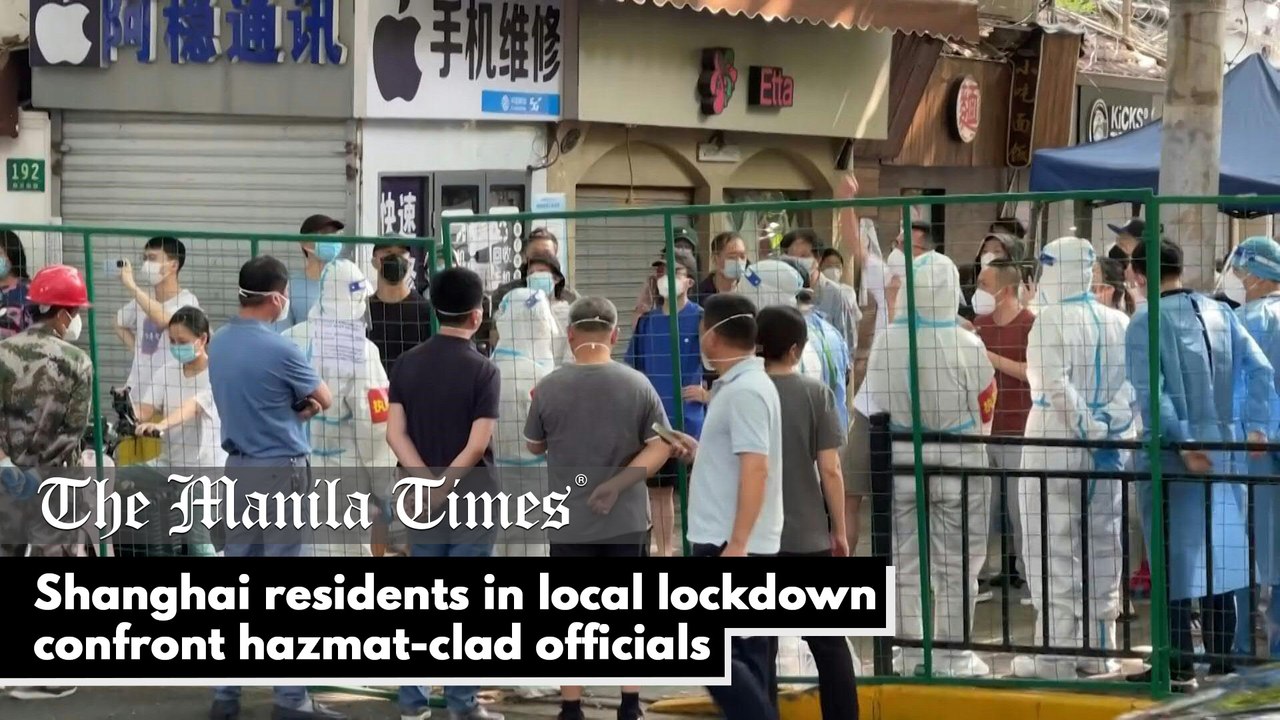 Shanghai residents in local lockdown confront hazmat-clad officials