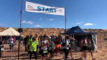 Runners stranded by floodwaters in the Queensland desert