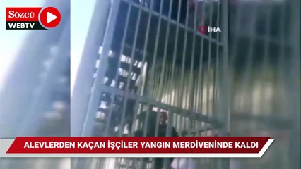 Alevlerden kaçan işçiler yangın merdiveninde mahsur kaldı