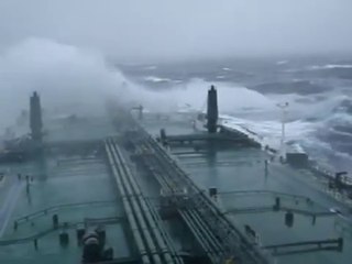 Large super tanker ship in huge storm in Atlantic Ocean