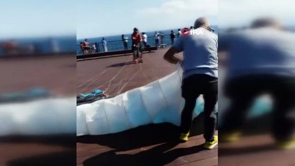 Uçuş yapmaya hazırlanan yamaç paraşütçüsü rüzgarın azizliğine uğradı