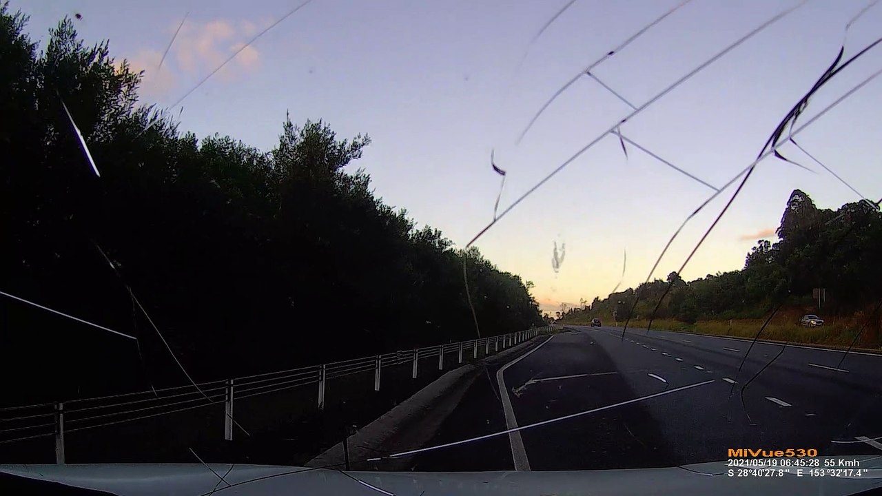Hammer Strikes Car Windshield on Australian Interstate
