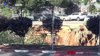 Israeli police inspect sinkhole in Jerusalem parking lot