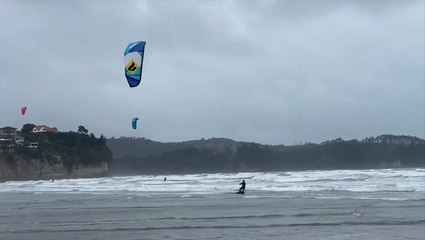 New Zealanders take to the sea for kitesurfing as winter arrives