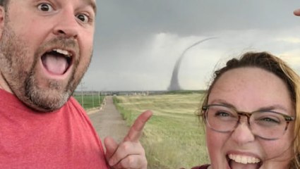 A selfie with dangerous weather in the background