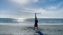 Girl Demonstrates Brilliant Moves With Hula Hoop on Beach