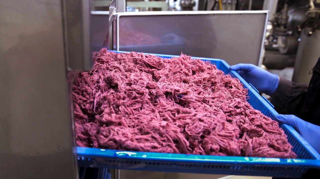 Inside a Swedish H&M store where recycling machines are making new clothes from old fabric