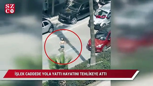 İşlek caddede yola yatan kadın, hayatını ve trafiği tehlikeye düşürdü