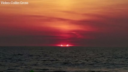 Solar eclipse turns the sky red off coast of US state of New Jersey