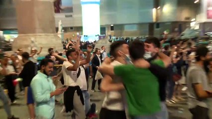 Italian fans celebrate after the Azzurri scores against Turkey