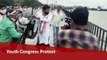 Congress workers throw bike into Hyderabad lake to protest fuel prices