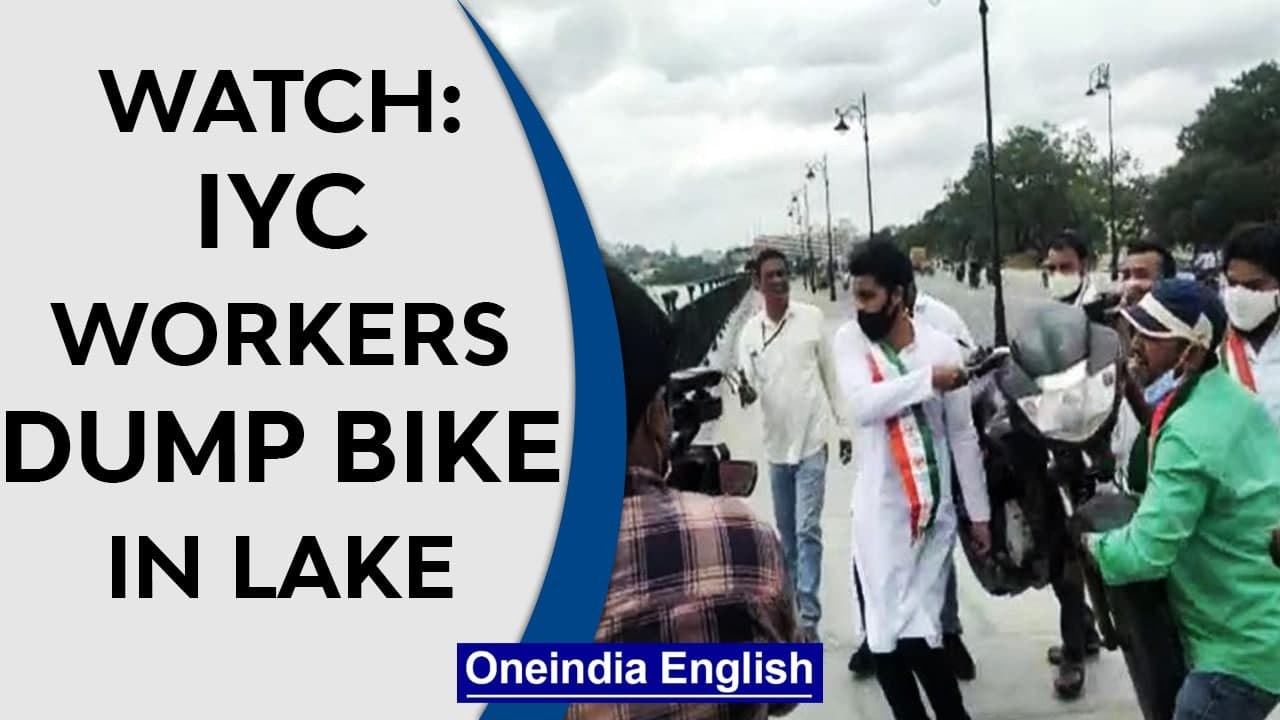 Hyderabad IYC workers throw bike in lake as a protest against rising fuel price |Watch|Oneindia News