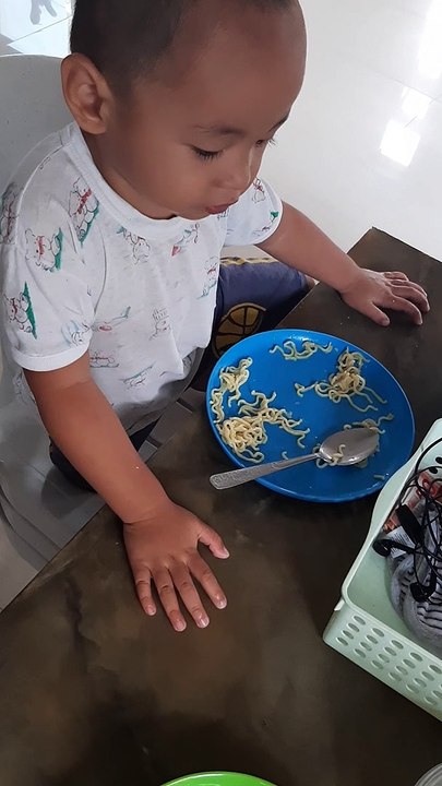 josh is eating noodles