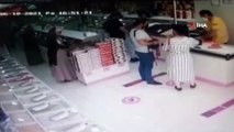 Hırsızlık yaparken yakalanan kadının market çalışanından dayak yediği anlar kamerada