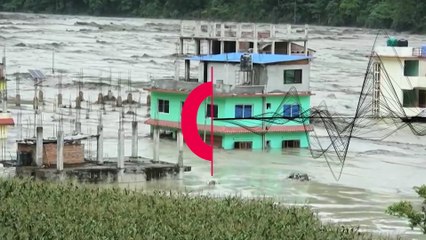 Rescuers at deadly Nepal flood as waters swirl through houses