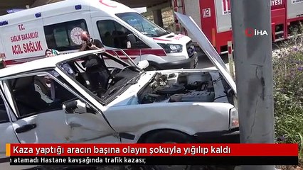 Kaza yaptığı aracın başına olayın şokuyla yığılıp kaldı