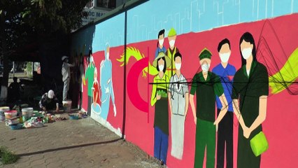 Murals on COVID-19 prevention hit Hanoi street