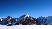 Snow covered mountain under blue sky video HD