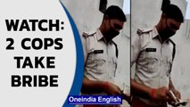 2 Chhattisgarh cops accept bribe in Mahasamund district; Caught on camera | Watch | Oneindia News