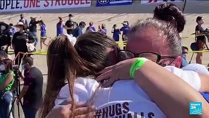 Separated families embrace at US-Mexico border for 'Hugs Not Walls'