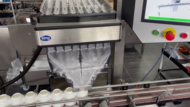 Filling Vitamin D tablets 100 count into bottles