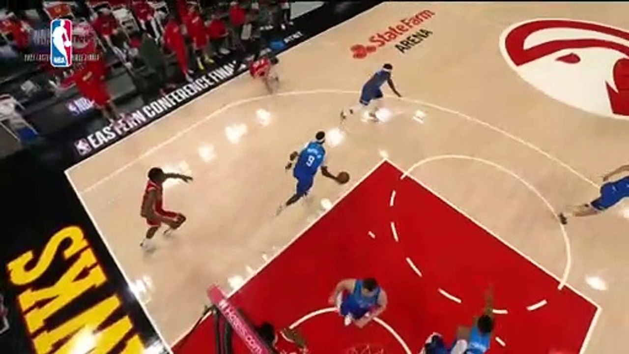 Trae Young tweaks his ankle after stepping on ref's foot