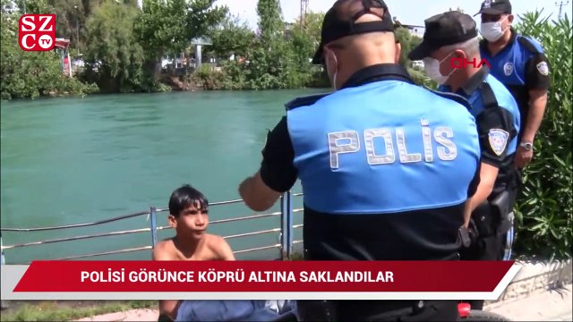 Sulama kanalında yüzerken polisi görünce köprü altına saklandılar