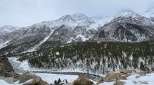Person Travels to Scenic Snow-Covered Mountains in India
