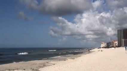 Heavy clouds hang over the beach