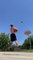 Guy Makes Three Consecutive Basketball Trickshots While Balancing Himself Over Slackline