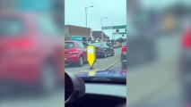 Shocking footage shows thugs battering a man in a brutal road rage attack in broad daylight - before a middle-aged woman breaks it up