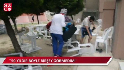İzmir’de aniden değişen hava kabus yaşattı masa sandalyeler havaya uçtu, insanlar kaçacak yer aradı