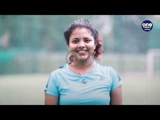 A young female sports manager gets the girls onto the pitch