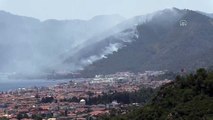 MUĞLA - Marmaris'te oteller ve yerleşim yerlerine yakın ormanlık alanda çıkan yangına müdahale ediliyor