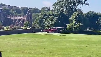 The Queen arrives at Holyrood House by helicopter