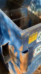 Man Helps Rescue a Racoon Stranded in Dumpster