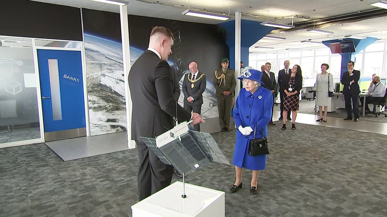 Queen and Princess Anne visit satellite centre
