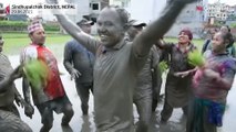 Nepal farmers jump into muddy fields to celebrate rice festival