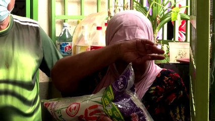 Malaysians hoist white flags for help in lockdown