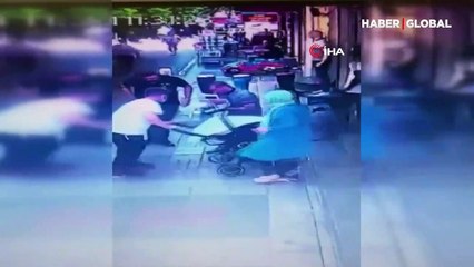 Bebeği arabadan düşüren babanın şoku kamerada