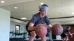 Man Displays Impressive Basketball Dribbling Skills While Standing Atop Balancing Board Blindfolded