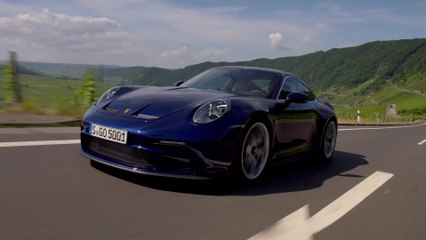 The new Porsche 911 GT3 with Touring Package in Blue Driving Video