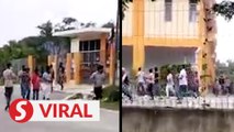 Three men arrested over video of fight at workers' hostel