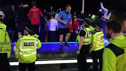 England fans celebrate in Barker's Pool fountains in Sheffield