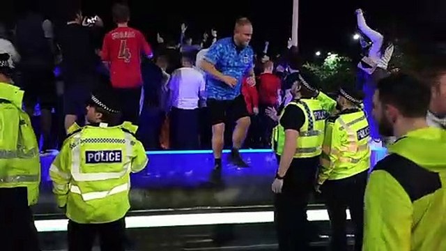England fans celebrate in Barker's Pool fountains in Sheffield