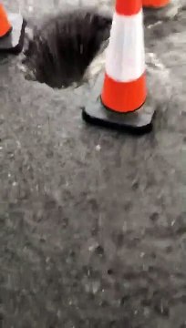 Torrential rain pours into sink hole as Doncaster street is flooded